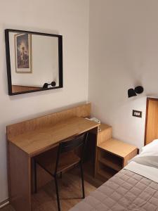 Postel nebo postele na pokoji v ubytování Hotel Umbria