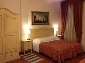 Postel nebo postele na pokoji v ubytování Hotel Umbria
