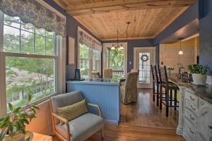 cocina con paredes azules y techo de madera en 2 Mi to Oaklawn Casino Home with Peaceful Yard!, en Hot Springs
