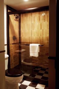 a bathroom with a glass shower with a toilet at Life House, Berkshires in Lenox