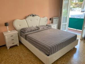 A bed or beds in a room at Appartamento Sandro by PortofinoVacanze