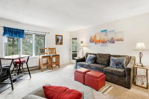 a living room with a couch and a table at Grandview Condo in Breckenridge