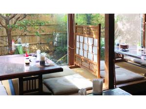 a room with a table and chairs and a window at Kagetsu Ryokan - Vacation STAY 04876v in Shizuoka