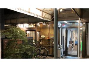 a bike parked inside of a building with a plant at Kagetsu Ryokan - Vacation STAY 04880v in Shizuoka