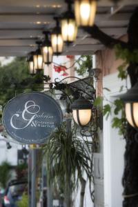 a sign on the side of a building with lights at Hotel Villa Gabrisa in Positano