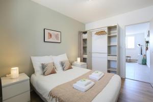 Posteľ alebo postele v izbe v ubytovaní expat renting - Le Bohème Zen - Proche Airbus
