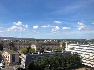 a view of a city with buildings and trees at Grand appartement lumineux - Thionville centre in Thionville