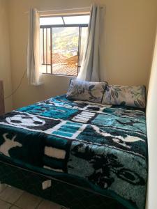 Ein Bett oder Betten in einem Zimmer der Unterkunft Cantinho Agradável em Ouro Preto