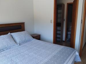 Cama o camas de una habitación en Casa Pingueral Tomé