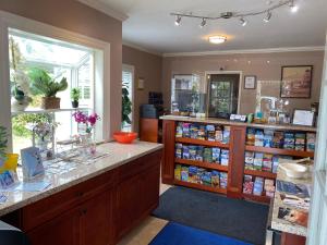 a room with a store with a counter and a window at Bide-A-Wee Inn and Cottages in Pacific Grove