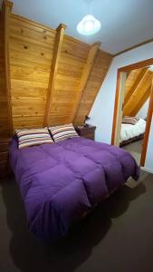 Una cama o camas en una habitación de Cabañas del Rosario