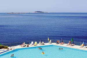 a swimming pool on a cruise ship overlooking the ocean at Apartments with a parking space Plat, Dubrovnik - 4776 in Mlini