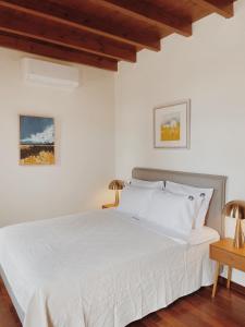 Postel nebo postele na pokoji v ubytování Kale Kapi City Living