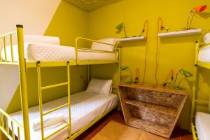 Letto o letti in una camera di Why Not Hotel