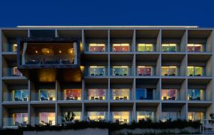 an external view of a building at night at Hotel Split in Podstrana