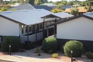 a house with a solar roof on top of it at Aspen Karratha Village in Karratha