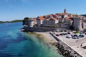a town on the shore of a body of water at Apartments by the sea Korcula - 10043 in Korčula