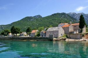 a small town on the shore of a body of water at Holiday apartments Duba Peljeska, Peljesac - 10230 in Orebić