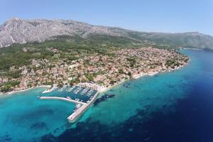 an aerial view of a beach with boats in the water at Apartments with a parking space Orebic, Peljesac - 10177 in Orebić