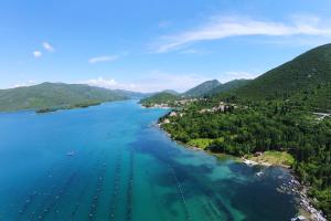an aerial view of a bay with boats in the water at Apartments by the sea Hodilje, Peljesac - 11189 in Ston
