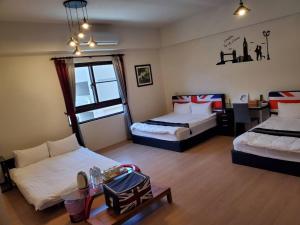 Postel nebo postele na pokoji v ubytování Jin Du Yi Yuan B & B