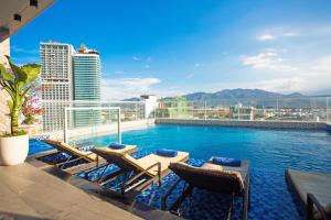 a swimming pool on the roof of a building at Le's Cham Hotel in Nha Trang