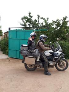two people are sitting on a motorcycle at Nurgul in Bokonbayevo