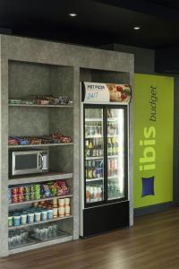 a refrigerator that has some food inside of it at ibis budget Hotel Edinburgh Park in Edinburgh