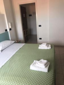 Posteľ alebo postele v izbe v ubytovaní Hotel Atlantic