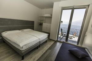 Campione Univela Rooms & Beds - Private Beach房間的床