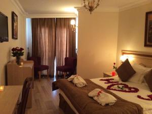 Postel nebo postele na pokoji v ubytování Sultan Palace Hotel