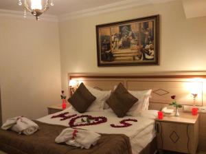 Postel nebo postele na pokoji v ubytování Sultan Palace Hotel