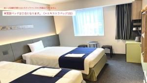 hotel MONday Premium Ueno Okachimachi房間的床
