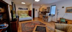 A bed or beds in a room at Sofia Apartment Kázmér