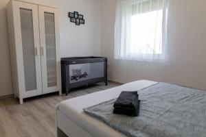 Letto o letti in una camera di Olivér 22 Apartman