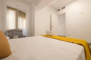 Posteľ alebo postele v izbe v ubytovaní Apartamento Ribera del Genil Centro