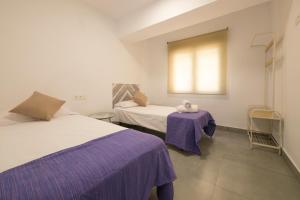 Posteľ alebo postele v izbe v ubytovaní Apartamento Ribera del Genil Centro