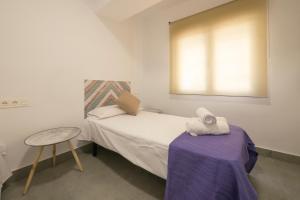 Posteľ alebo postele v izbe v ubytovaní Apartamento Ribera del Genil Centro