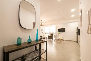 Televízia a/alebo spoločenská miestnosť v ubytovaní Apartamento Ribera del Genil Centro