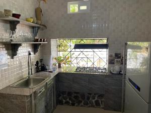 Kuchyň nebo kuchyňský kout v ubytování Le Comfort (self catering)