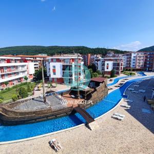 a resort with a swimming pool and a beach at Privilege Fort Beach - Sea Viev Premium Apartments in Elenite