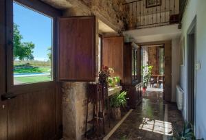 a hallway of a house with a large window at CASA DO LEAL SILVER WAY in Silleda