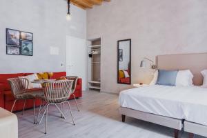 A bed or beds in a room at Five Stars Sicily by Ortigia Apartments
