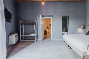 A bed or beds in a room at Five Stars Sicily by Ortigia Apartments