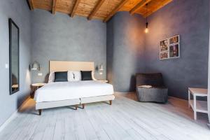 A bed or beds in a room at Five Stars Sicily by Ortigia Apartments