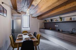 A kitchen or kitchenette at Five Stars Sicily by Ortigia Apartments