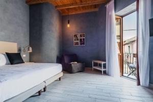 A bed or beds in a room at Five Stars Sicily by Ortigia Apartments