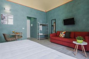 A bed or beds in a room at Five Stars Sicily by Ortigia Apartments