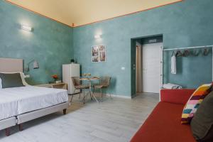 A bed or beds in a room at Five Stars Sicily by Ortigia Apartments
