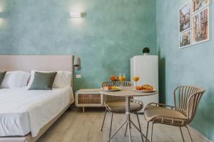 A bed or beds in a room at Five Stars Sicily by Ortigia Apartments